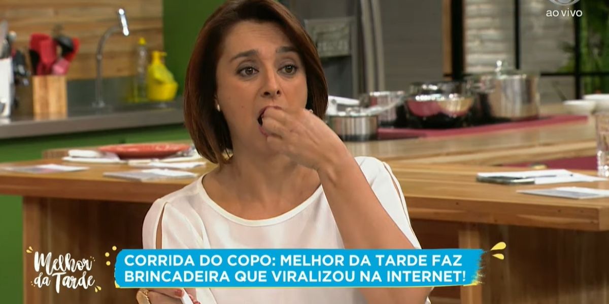 Catia Fonseca comendo alho ao vivo (Reprodução/Band)