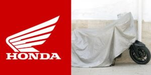 Logo da Honda e moto coberta - Foto Reprodução Internet