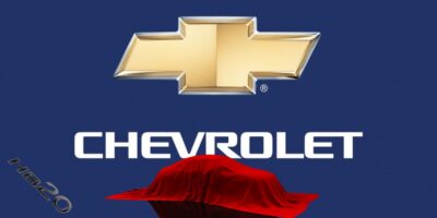 Logo da Chevrolet e carro coberto - Foto Reprodução Internet